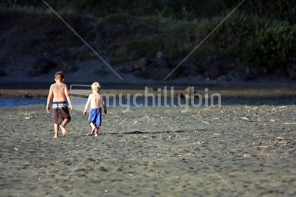 Two boys on Piha Beach