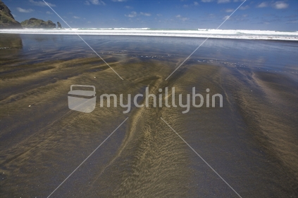 Patterns in the sand at low tide, Piha beach