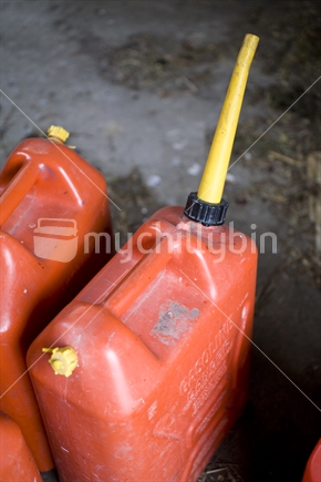 Red plastic oil containers