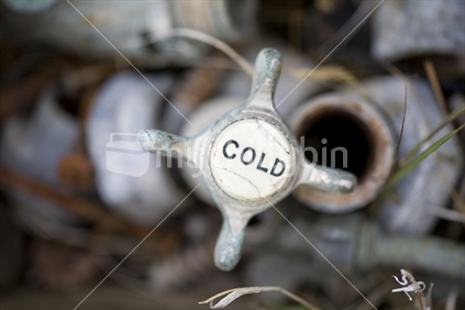 A cold tap in a junk heap