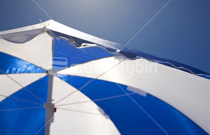 Blue and white beach umbrella