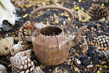 A discarded old rusty tea pot