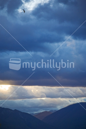 Storm clouds over the Wakatipu basin at sunset, New Zealand