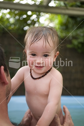 A cute young girl enjoying a spa with her dad