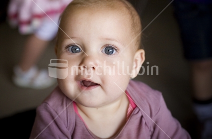 An expressive baby girl with big blue eyes