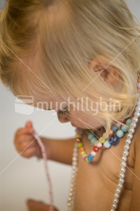 young girl with necklaces