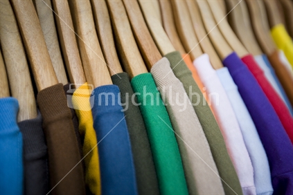 coloured tshirts hanging up