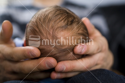 Baby in fathers hands