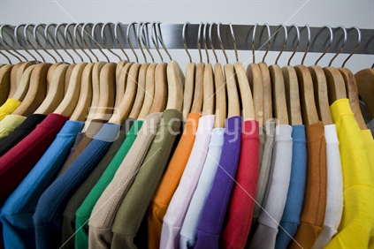 Coloured t shirts hanging up