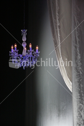 Chandelier and curtain lit up