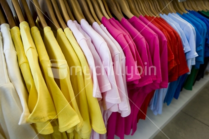 Coloured t shirts hanging up