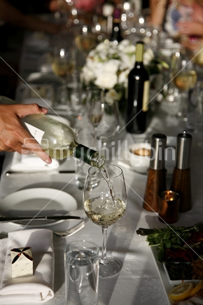 Pouring wine at a wedding reception party