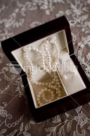 jewelery box with pearl necklace and earrings