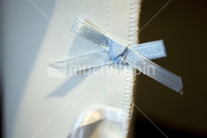 Blue ribbon bow on inside seam of wedding dress 