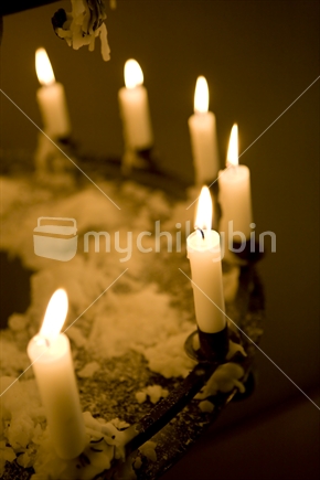 Candelabra of white burning candles