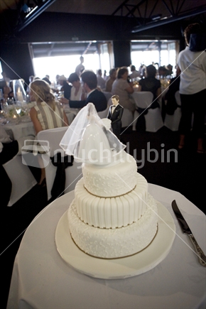 Wedding cake at a full wedding reception