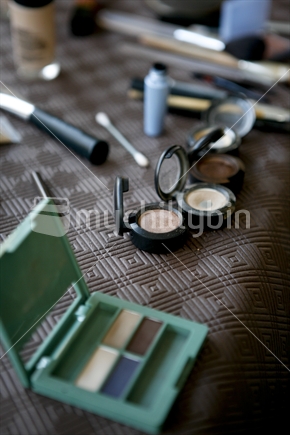 Makeup strewn over a table