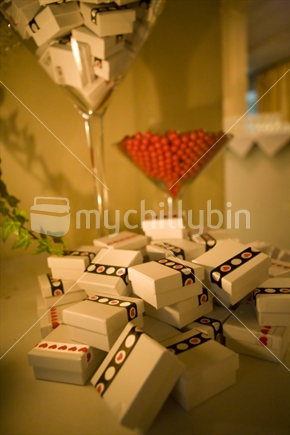 Boxes of party favours and a jar of chocolate lollies