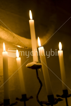 Candelabra with five tall lit candles