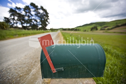 Rural letter box with its red flag up