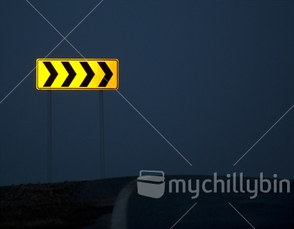 Yellow directional road sign