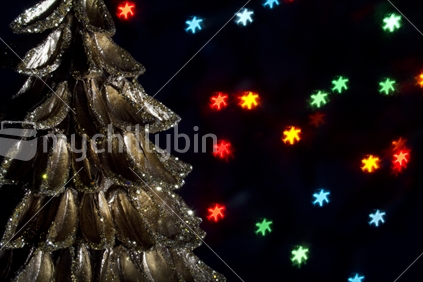 Golden christmas decoration with fairy lights in background, bokeh background.