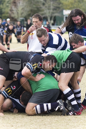 Action image of men playing game of provincial Rugby union.