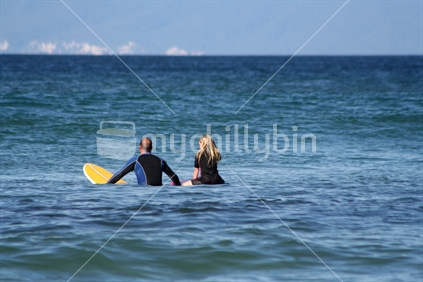 Dad and Daughter Surfing
