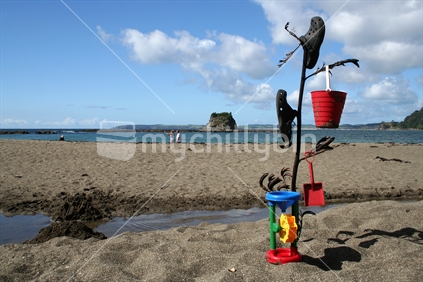 Abandoned beach toys at Mathesons Bay, New Zealand