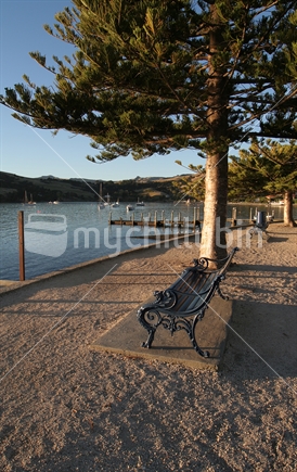 Park bench overlooking the harbour at Akaroa, New Zealand