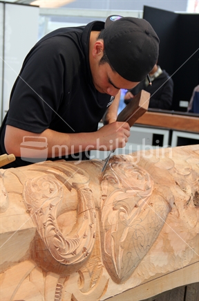 Young Maori wood carver at work, taken at the Viaduct during public RWC festivities 2011. 