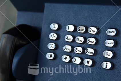 Closeup of numbers from a pay telephone box. 