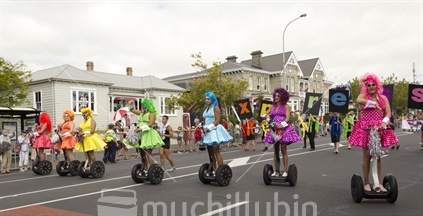 Group of cross dressers riding sedgeways in the Auckland Gay pride parade. 