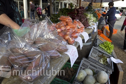 Matakana village Farmers Market, produce stall selling fresh locally grown vegetables.