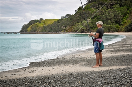 Fishing from a deserted beach