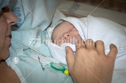 Newborn baby (selective focus and low light)
