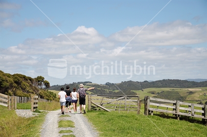 Family walk across farmland