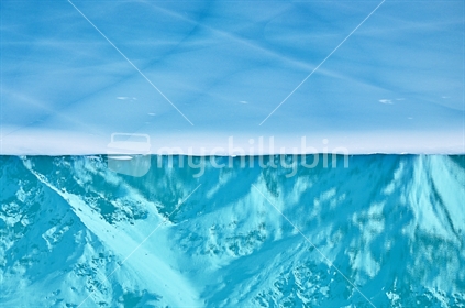 Reflections in frozen Tasman Glacier lake