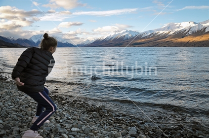 Skimming stones at Lake Ohau (selective focus and some motion blur)