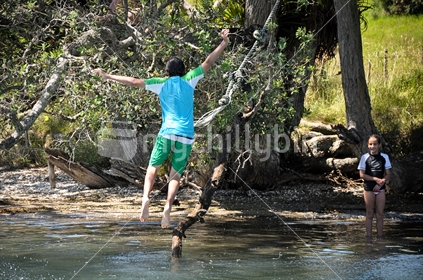 Kids on a rope swing (some motion blur)