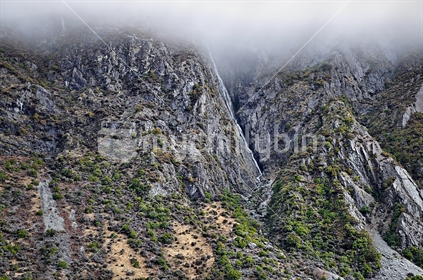 Mountain waterfall up in the clouds