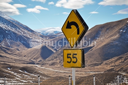 Tight bend road sign at the Lindis Pass