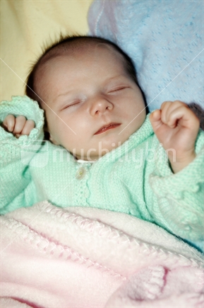Sleeping baby in pastel colours