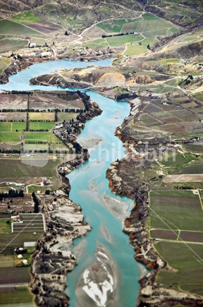 Aerial view of farmland and the Kawarau River (with selective focus) as it nears Cromwell, Central Otago, South Island, New Zealand