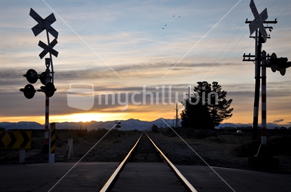 Sunset railway crossing. Low light and selective focus. (see also same location: Image #mychillybin100468_1308 )