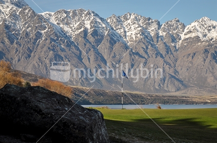 Golf green with The Remarkables background