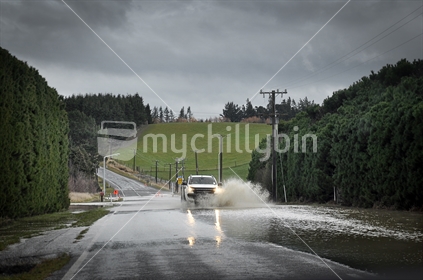 Flooded road in a storm (low light and some motion blur)
