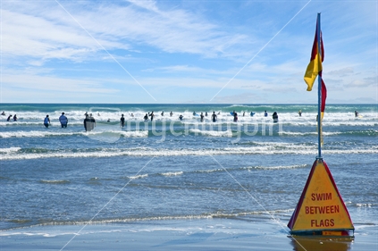 Lifeguard safety flag on west coast beach near Auckland
