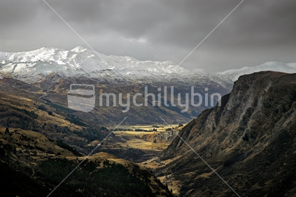 View down Shotover River Gorge to Coronet Peak Ski field from Queenstown, South Island New Zealand