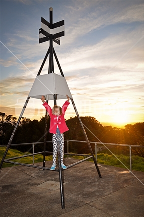 Girl in a pink coat on Mt Albert Trig Station at Sunset
(see also #100468_656)